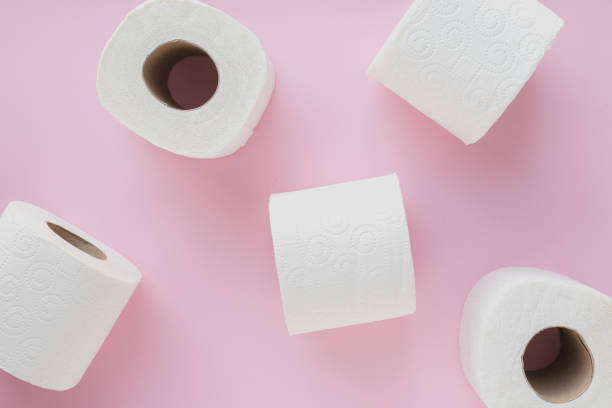 istock Toilet paper on pink background 1215405726