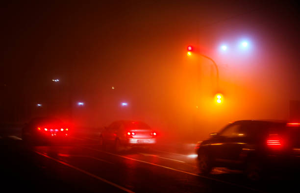 istock Red lights on a foggy night 1215406831