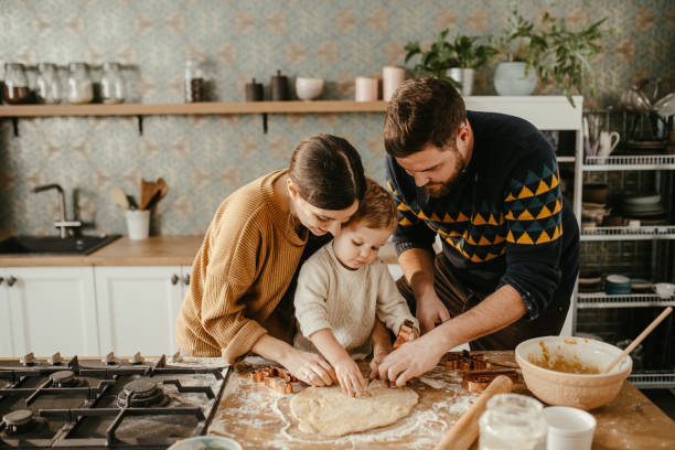 istock Family together at the kitchen counter 1215406956