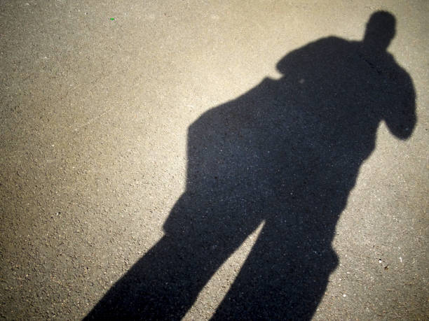 istock Shadow of a photographer 1215406993