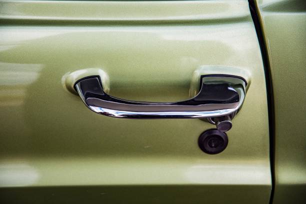 istock Closeup car door handle  retro 1215409224