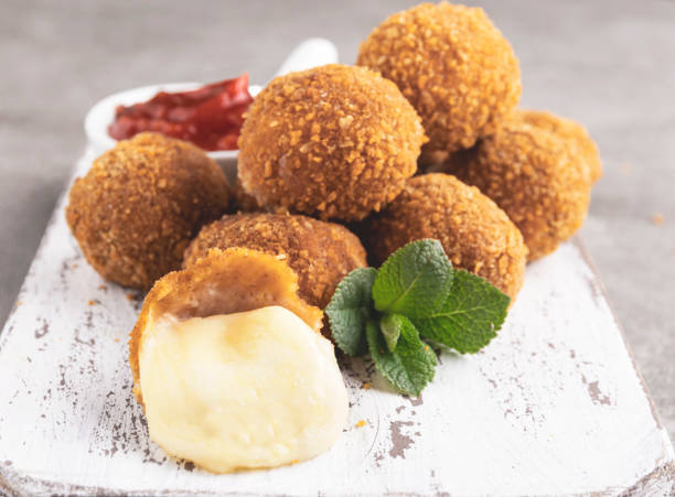 istock Breaded mozzarella cheese balls with tomato sauce 1215409988