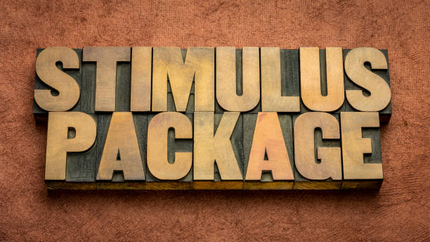 stimulus package word abstract in wood type stimulus package word abstract in vintage letterpress wood type against textured handmade paper, relief bill during covid-19 coronavirus pandemic printing block photos stock pictures, royalty-free photos & images