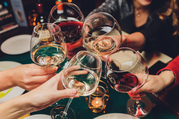 istock Clinking glasses with alcohol and toasting, party. 1215414781