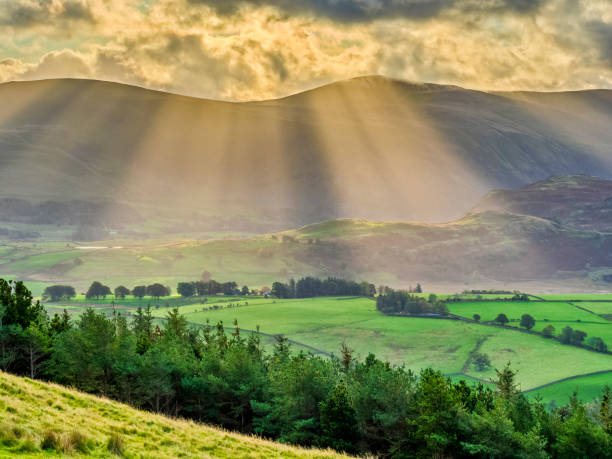 The Lake District region of the United Kingdom View of mountains surrounding Derwentwater at sunrise in the Lake District in the United Kingdom keswick stock pictures, royalty-free photos & images