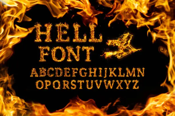 Photo of Hell Font set. Fire flames on black isolated background, realistick fire effect with sparks. Part of alphabet set