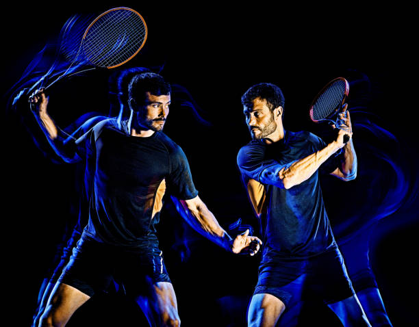 istock Tennis player man light painting isolated black background 1215423705