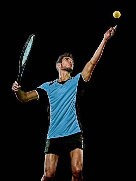 istock caucasian young tennis player man isolated black background 1215423774