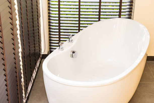 istock White bathtub and hot tub decoration interior 1215428016