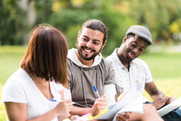 istock Group of University Students Sit Outside stock photo 1215428801