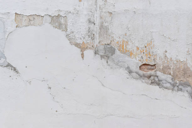 istock Abstract old white concrete wall background. Texture of cement 1215430239