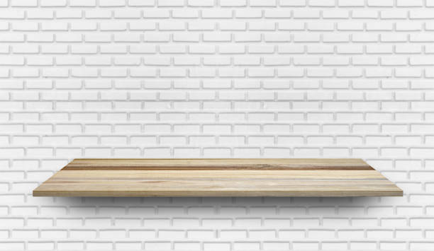 istock Empty wood plank shelf at white brick wall pattern background. Design for product display, mockup, advertise, banner, or montage 1215433770