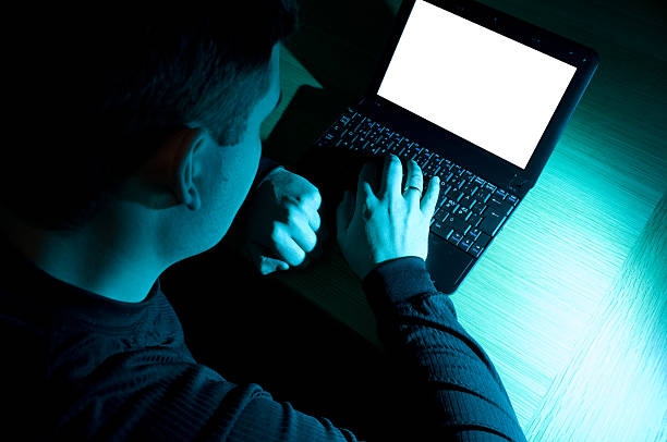 istock Man works late at night on laptop 121544171