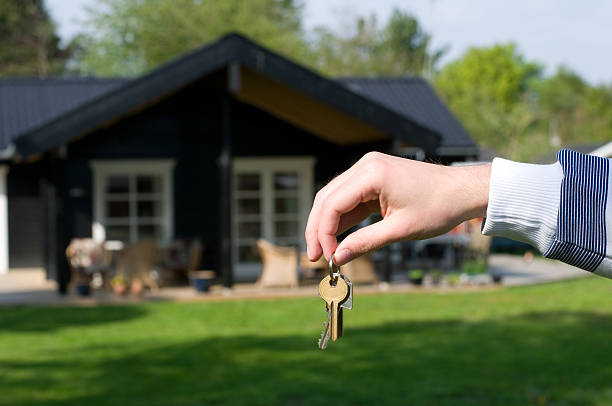 istock Hand holds keys to a new home or house 121544418