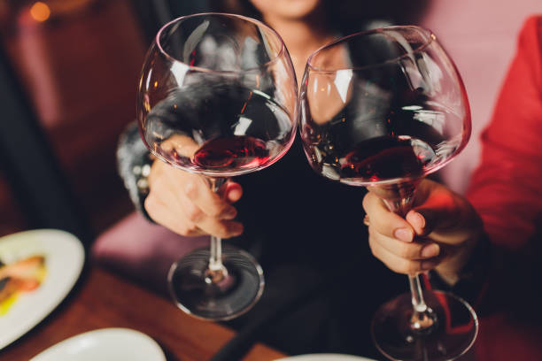 istock Clinking glasses with alcohol and toasting, party. 1215447018