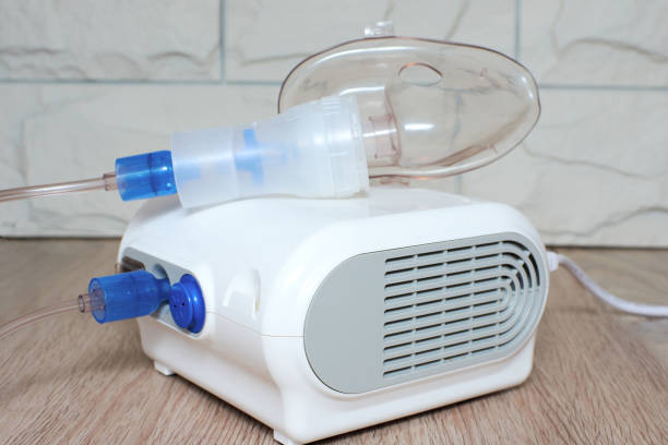 istock Compressor nebulizer for carrying out inhalation of the house. 1215448336