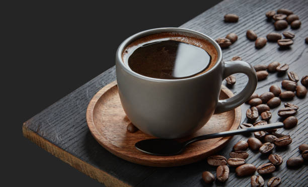 istock cup of black coffee on wooden table 1215448920