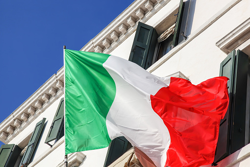 Italian flag against house in Venice, Italy