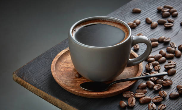 istock cup of black coffee on wooden table 1215449529
