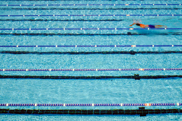 istock Person swimming in a pool 1215450848