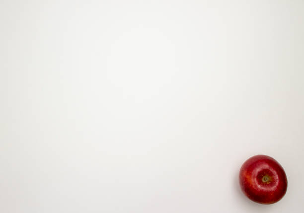 A delicious apple put on a white paper with space.