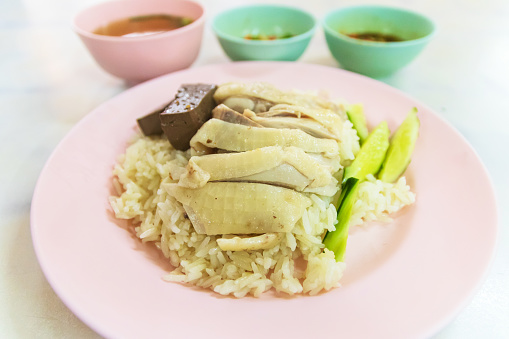 Steamed rice with chicken (Kao Mun Gai) served with ginger garlic sauce and soup.