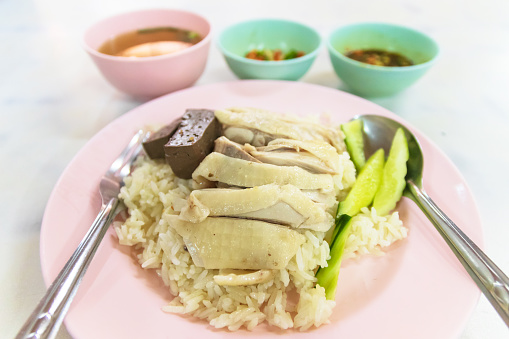 Steamed rice with chicken (Kao Mun Gai) served with ginger garlic sauce and soup.