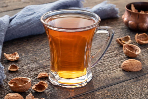 A cup of tea made from walnut shells - a folk remedy for cough stock photo