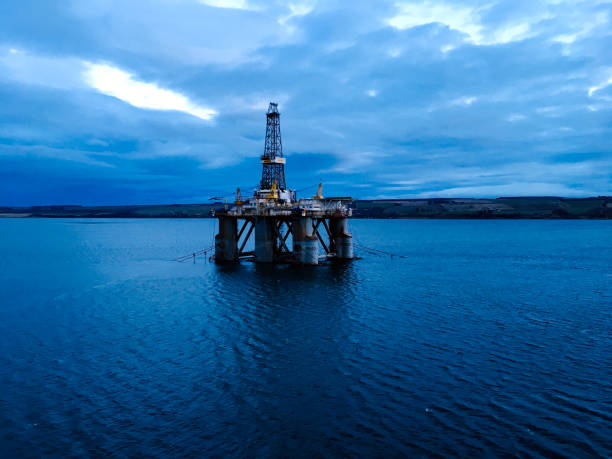 istock Oil Rig in the dusk 1215458605