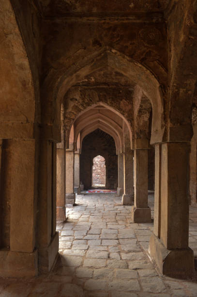 istock A sun create some dramatic view inside the monument at hauz khas memorial from the side of the lawn at winter foggy morning. 1215458658