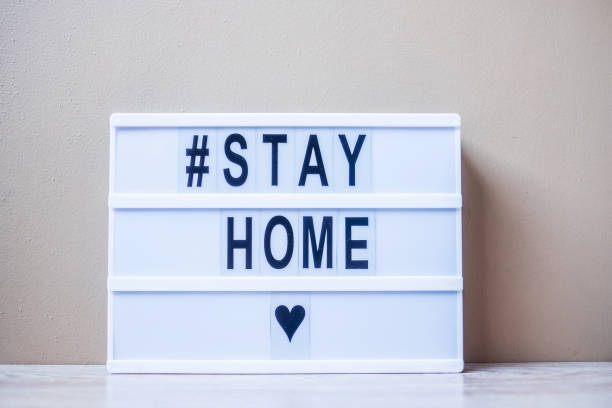 istock lightbox with text #STAY HOME on table. Coronavirus, Covid-19, Quarantines and Social Distancing concept 1215462059