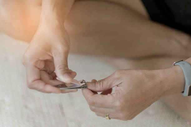 istock nail clippers, fingernail, closeup hand 1215463153