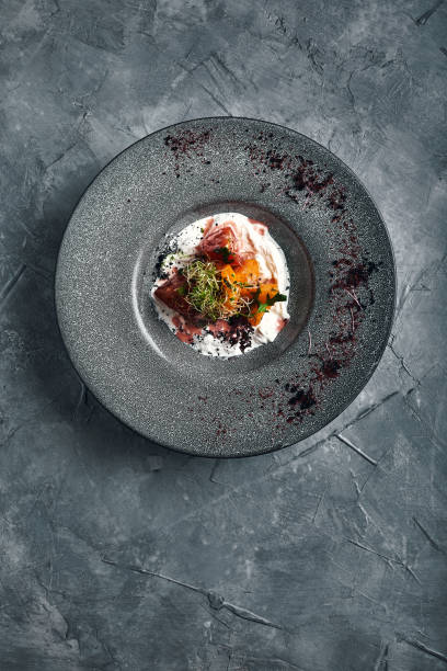 istock Bell pepper and strawberry strachatella salad. top view, beautiful table setting, beautiful serving, traditional italian food, gray background, copy space. food concept 1215465846