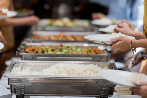 istock scooping the food, catering, dinner time 1215467557