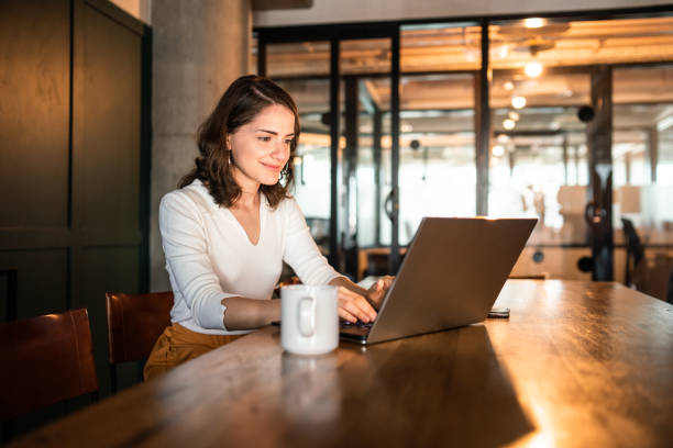 istock Young Argentinian woman working on her laptop 1215470259