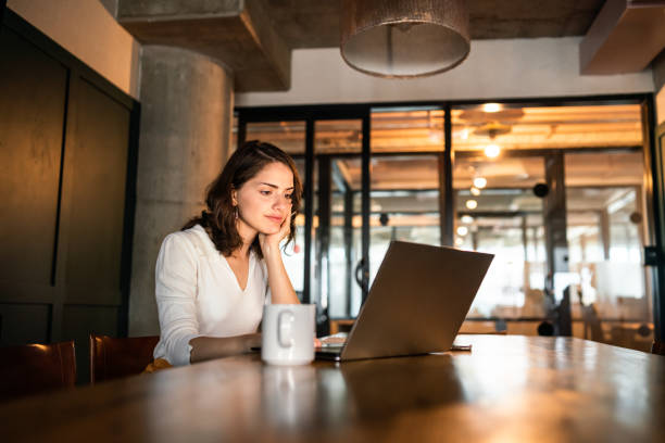 istock Young Argentinian woman working on her laptop 1215470584