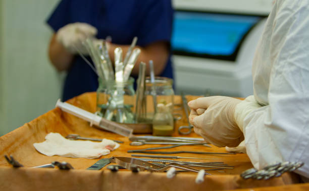 istock hands of assistant surgeon 1215470715