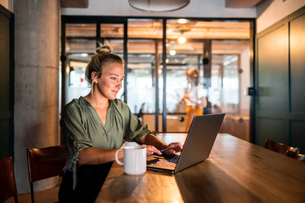 istock Young Argentinian woman working on her laptop 1215471672