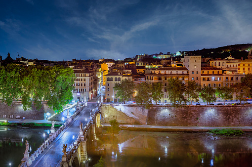 Bridge to Castle of Holy Angel with nobody around at night in Rome historic centre, view from above.