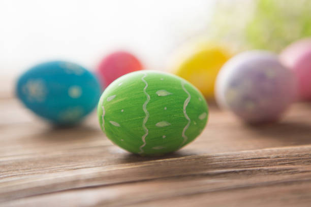 istock Colorful easter eggs with flowers on a old wooden surface 1215472816