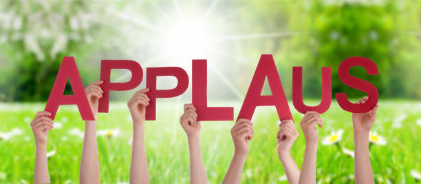 People Hands Holding Word Applause Means Applause, Grass Meadow People Hands Holding Colorful German Word Applaus Means Applause. Sunny Green Grass Meadow As Background applaus stock pictures, royalty-free photos & images