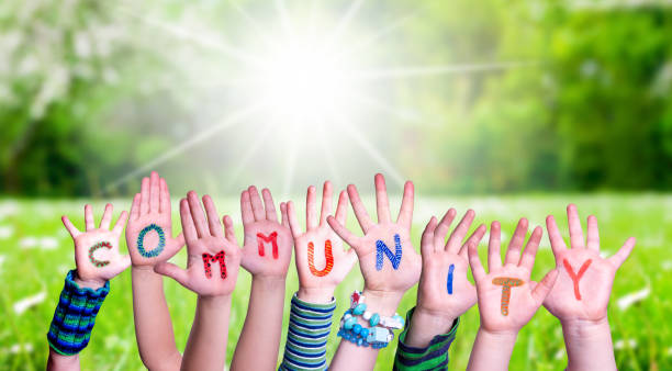 istock Children Hands Building Word Community, Grass Meadow 1215473318