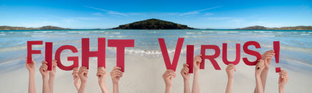 istock People Hands Holding Word Fight Virus, Ocean Background 1215474353