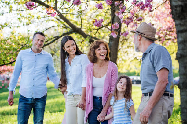istock Three generation family on a walk outside in spring nature. 1215474613