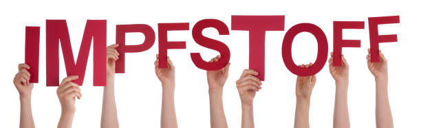 istock People Hands Holding Word Impfstoff Means Vaccine, Isolated Background 1215474636
