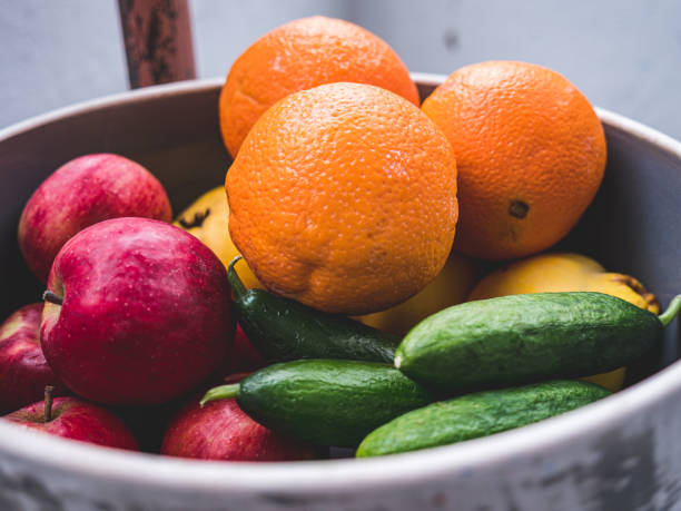 istock Organic fruits and vegetables in a bowl 1215478401
