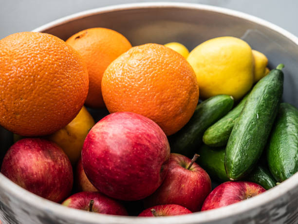 istock Organic fruits and vegetables in a bowl 1215478656