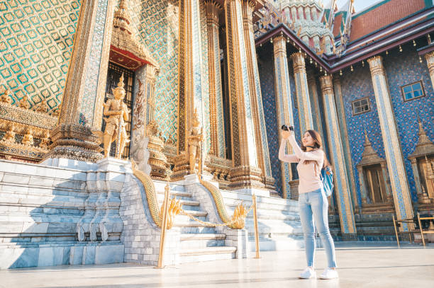 istock women travel with camera sightseeing in temple 1215481842