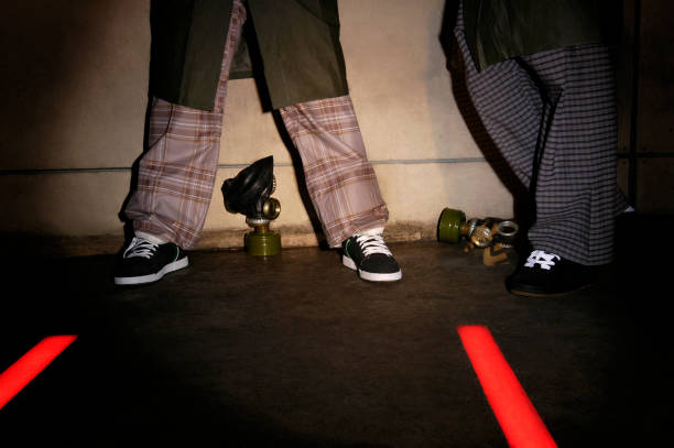 istock Close-up two men standing with gas masks on the floor 1215484540