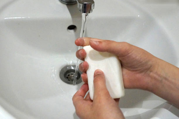 istock hands wash with soap, closeup 1215484594